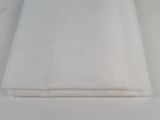 the white cloth is folded on top of the table