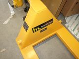 a yellow machine that is sitting on the floor