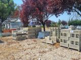a lot of concrete blocks sitting in the dirt