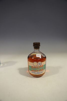 a bottle of maple syrup sitting on a table