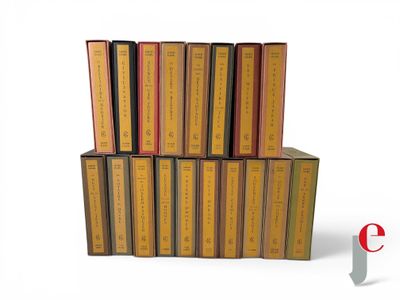 a lot of books stacked on top of each other