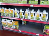 many bottles of deters on the shelves in the store