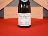 a bottle of wine that is sitting on a table