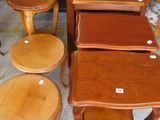 several tables and stools that are sitting in a room