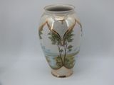 a vase with a picture of a tree on it