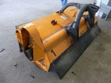 a yellow snow plow that is sitting on the ground