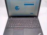 a laptop that is open on a white table