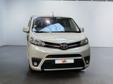 the front view of a white car in a white room