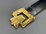 a close up of a belt with a gold buckle on it