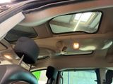 a view of the sunroof from inside of a car