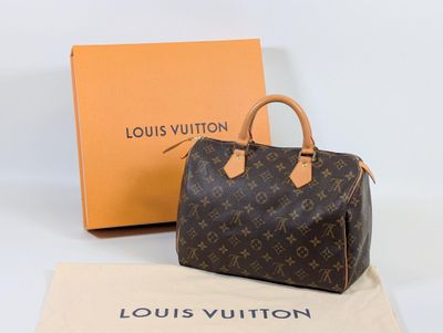 louis vuitton speedy bag in monogram canvas and tan leather