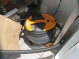 an image of a vacuum cleaner in a kitchen