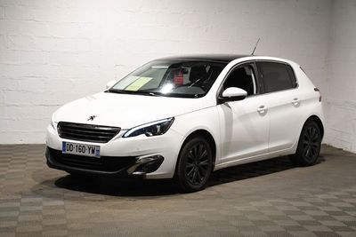 the small white car is parked in the garage of the building