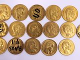 a lot of gold coins that are on the table
