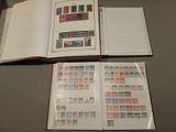 a book with stamps on it sitting on a table