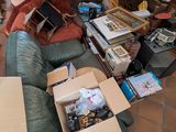 a couch with a box of stuff on it in a living room