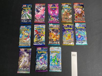 a lot of pokemon cards on the table next to a ruler