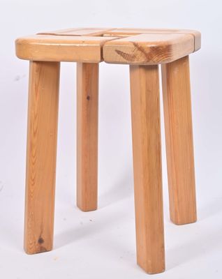 two wooden stools sitting side by side on a white background
