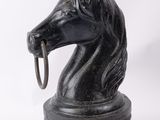 an image of a statue of a horse with a ring in it ' s mouth