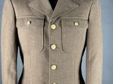 a brown jacket with gold buttons on a mannequin mannequin