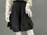 an image of a mannequin dressed in black and white