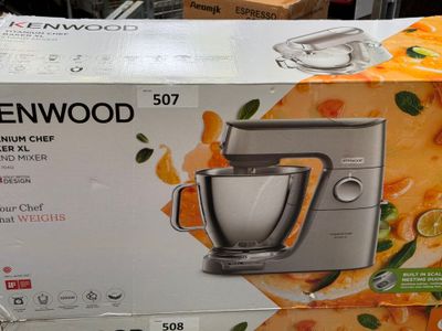 a box of kenwood mixer on display in a store