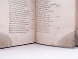 an open book with a picture of a man on it