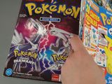 someone is holding a box of pokemon trading cards in their hand
