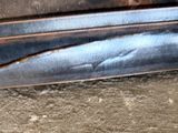 a close up of a piece of wood with a hole in it