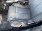 an image of a dirty car seat in the back of the car