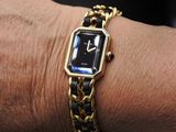 a woman that is wearing a watch on her wrist