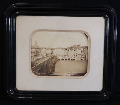 a black and white photo of a bridge over a river