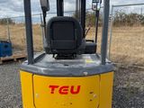 a close up of a fork lift truck parked in a parking lot
