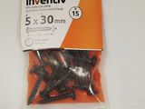 a bag of screws on a white surface