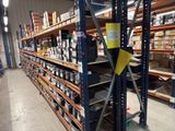 a large rack with many items on it in a warehouse