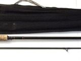 two fishing rods and a fishing rod on a table