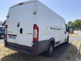 a white van that is parked on the side of the road