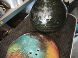 two vases sitting on top of a table in a room