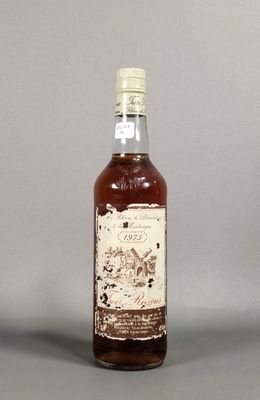 an image of a bottle of whiskey sitting on top of a table