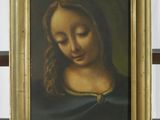 une photo d'un tableau représentant une femme, dans un cadre doré