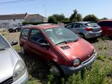 a red car that is parked in a parking lot