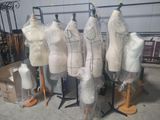 many mannequins on display in a room