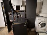 an image of a dirty laundry room with a washing machine and dryer