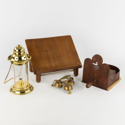 a small wooden table with a lamp and other items on it