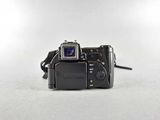 a camera that is sitting on a white surface