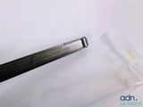 a pair of scissors sitting on top of a piece of plastic