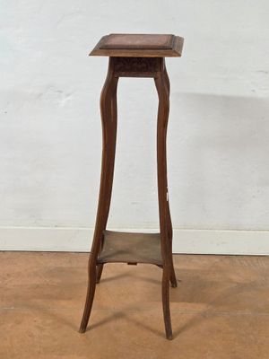 a small wooden table with a shelf on top of it