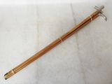 a pair of wooden chopsticks sitting on top of a white surface