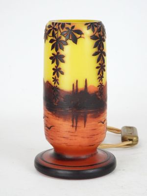 a lamp that has a picture of a sunset on it