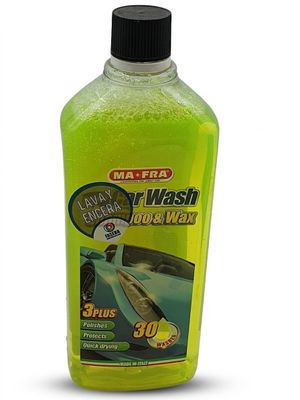 the bottle of liquid is green and has a black cap